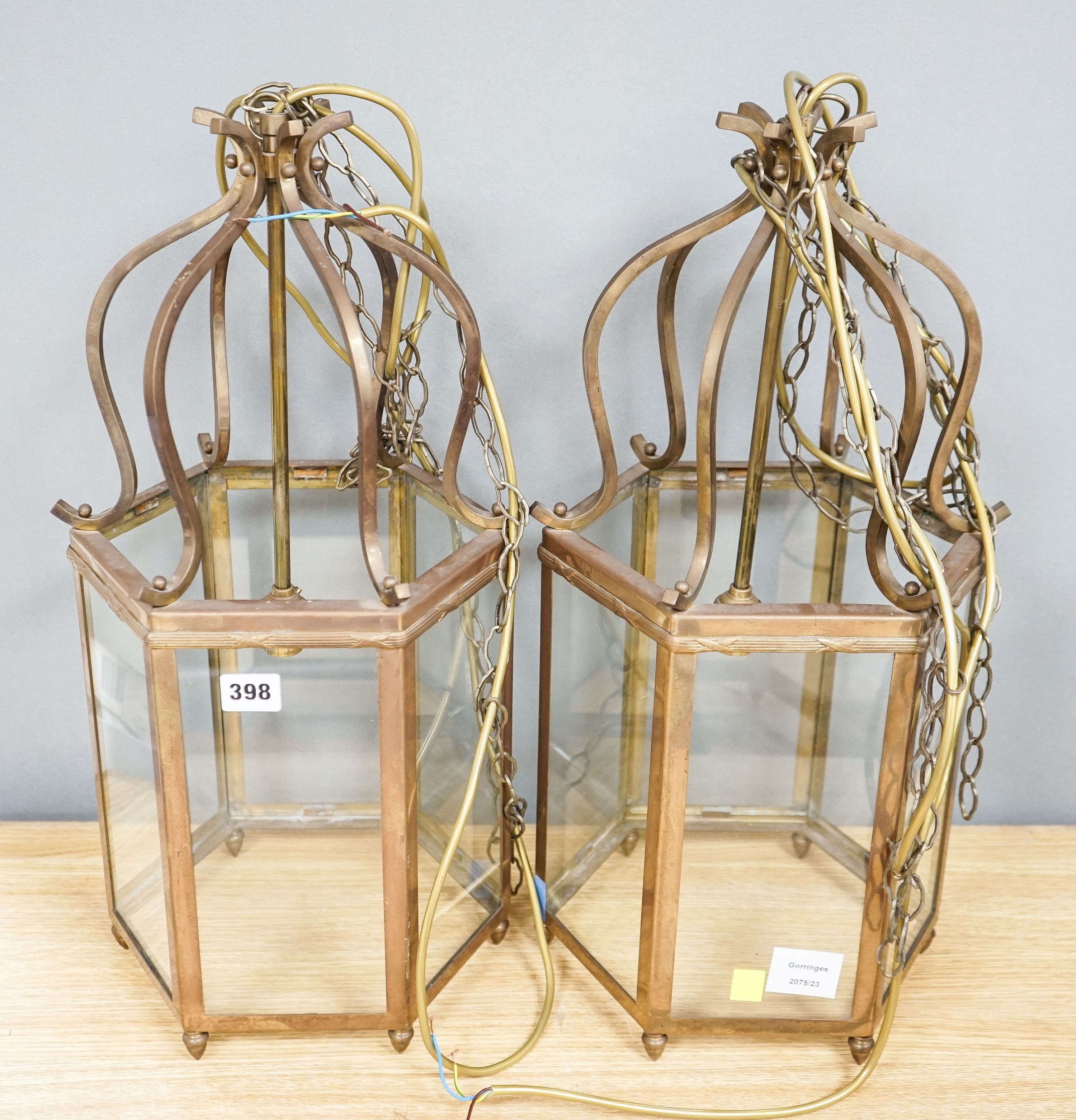 A pair of brass hexagonal lanterns 54cm